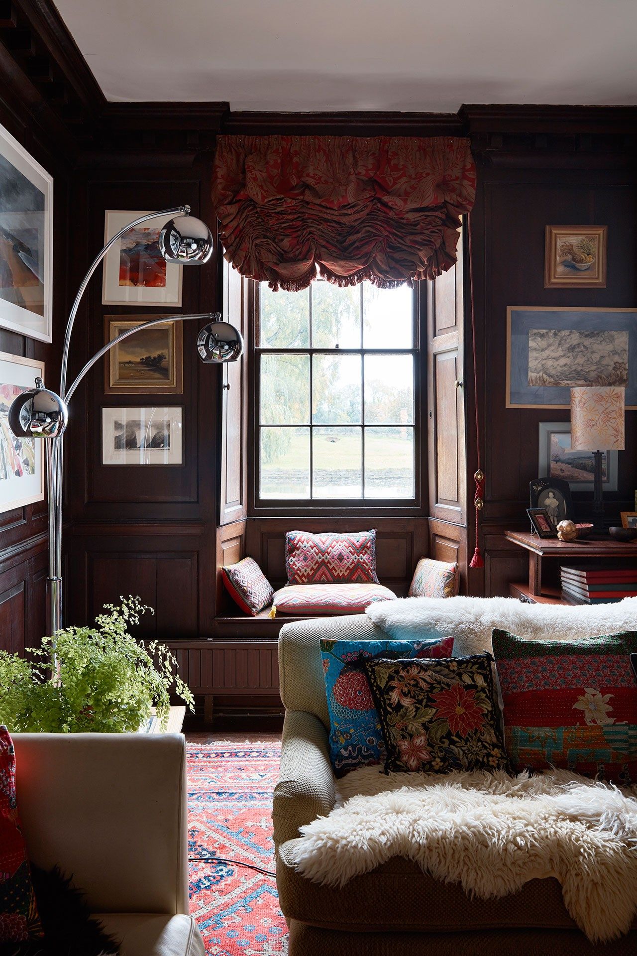 Image may contain Living Room Indoors Room Furniture Couch Home Decor and Rug