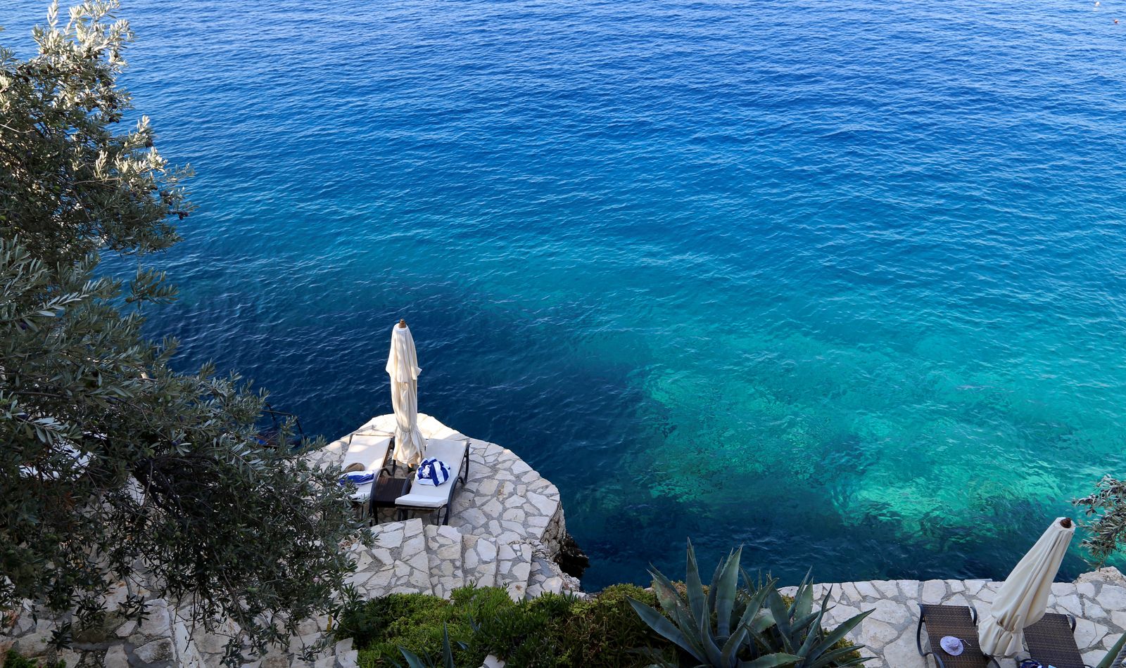 Image may contain Promontory Outdoors Nature Water Ocean Sea Plant Transportation Vehicle and Boat