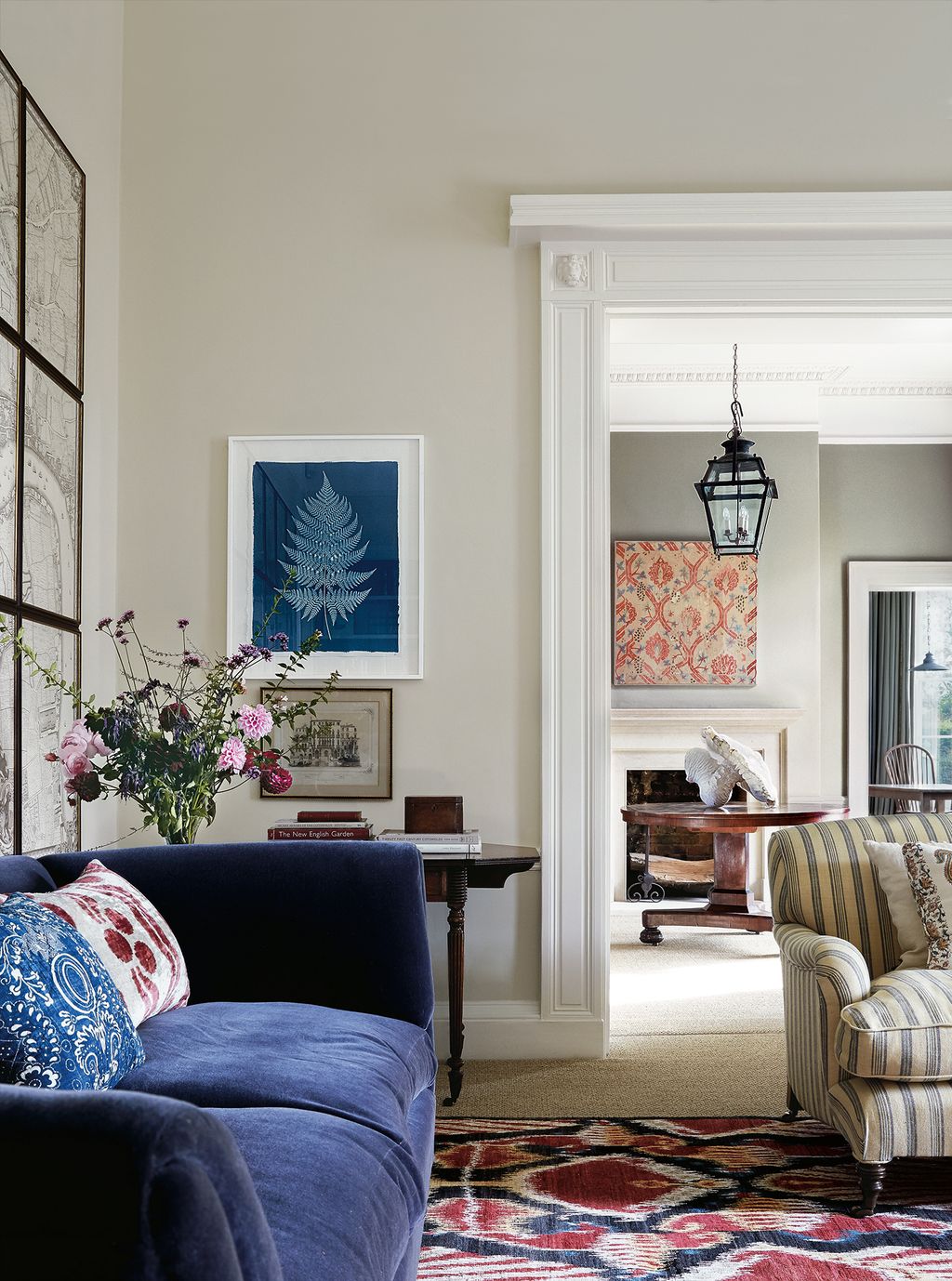 Image may contain Living Room Room Indoors Furniture Couch Interior Design and Plant