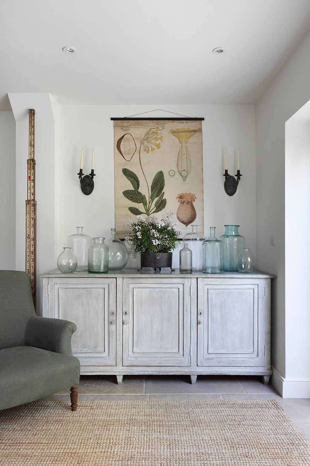 A collection of antique glassware sits on the sideboard in the kitchen.