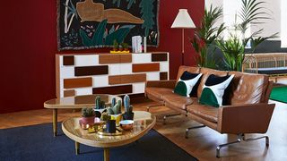 Image may contain Living Room Room Indoors Furniture Table Couch Coffee Table Lobby and Wood