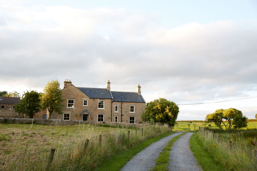 Image may contain Nature Outdoors Cottage Housing House Building Shelter Countryside Rural and Road