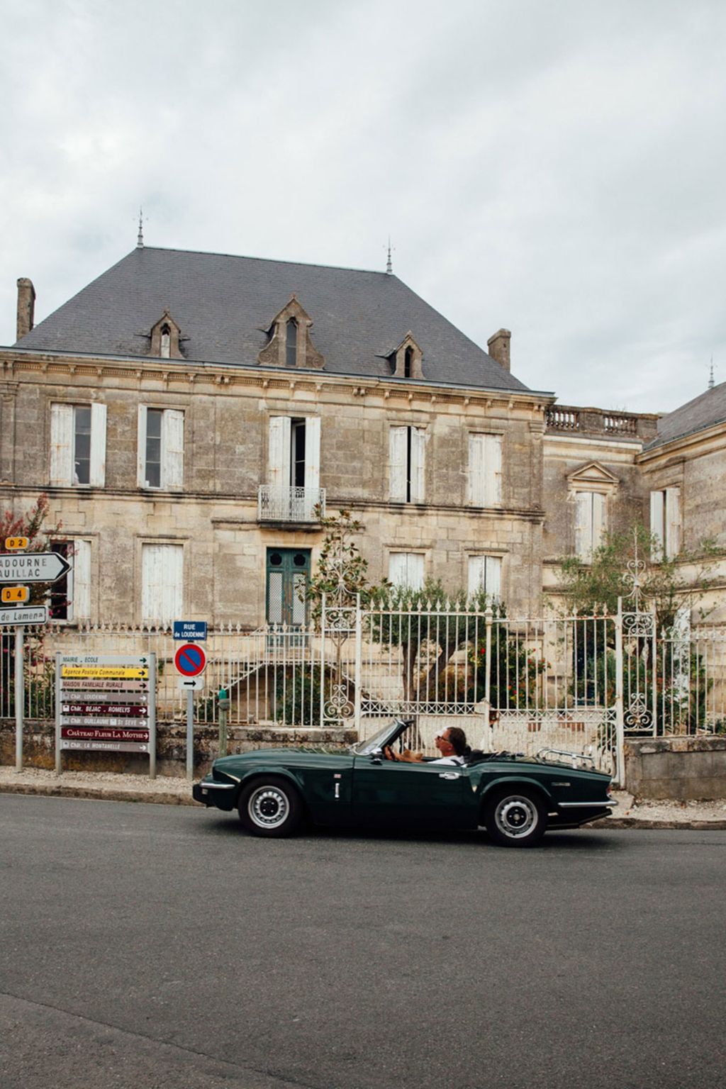 Image may contain Car Transportation Vehicle Automobile Urban and Building