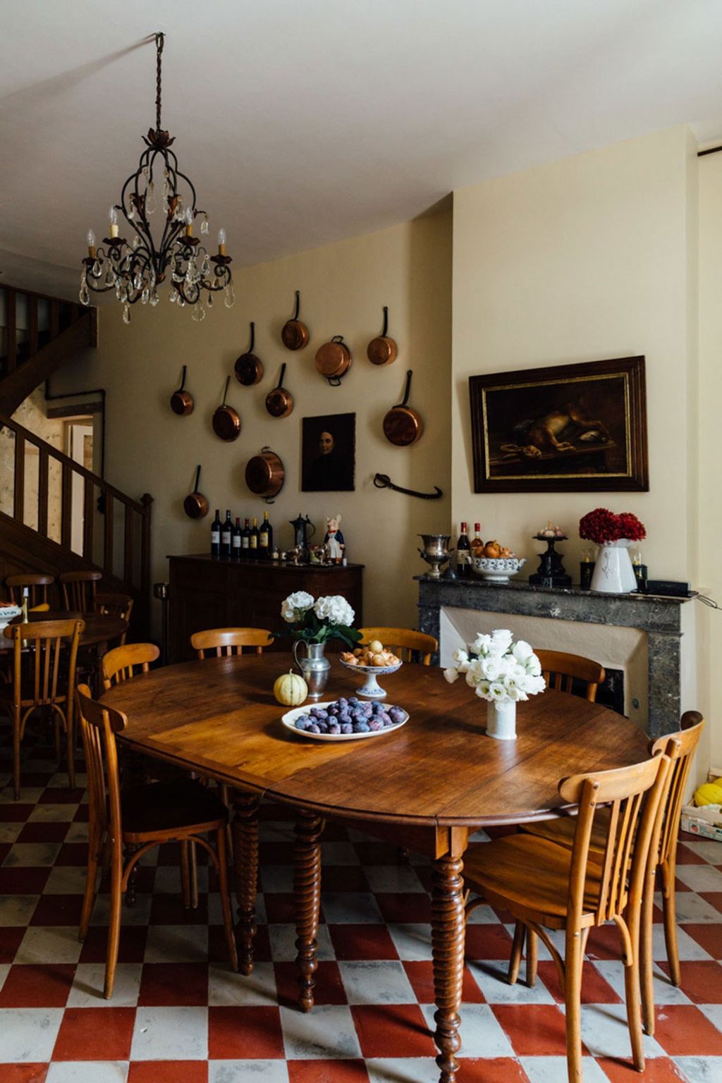 Image may contain Furniture Chair Room Indoors Dining Room Wood Hardwood Dining Table Table and Living Room