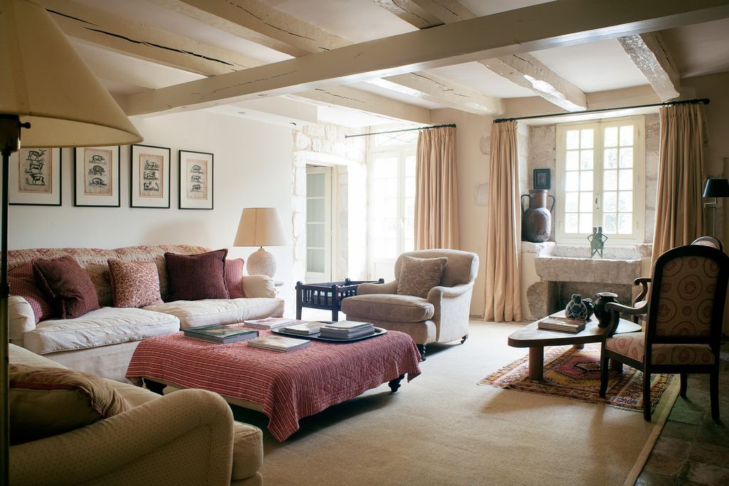 Image may contain Furniture Living Room Room Indoors Chair Bedroom Couch Rug Table and Interior Design