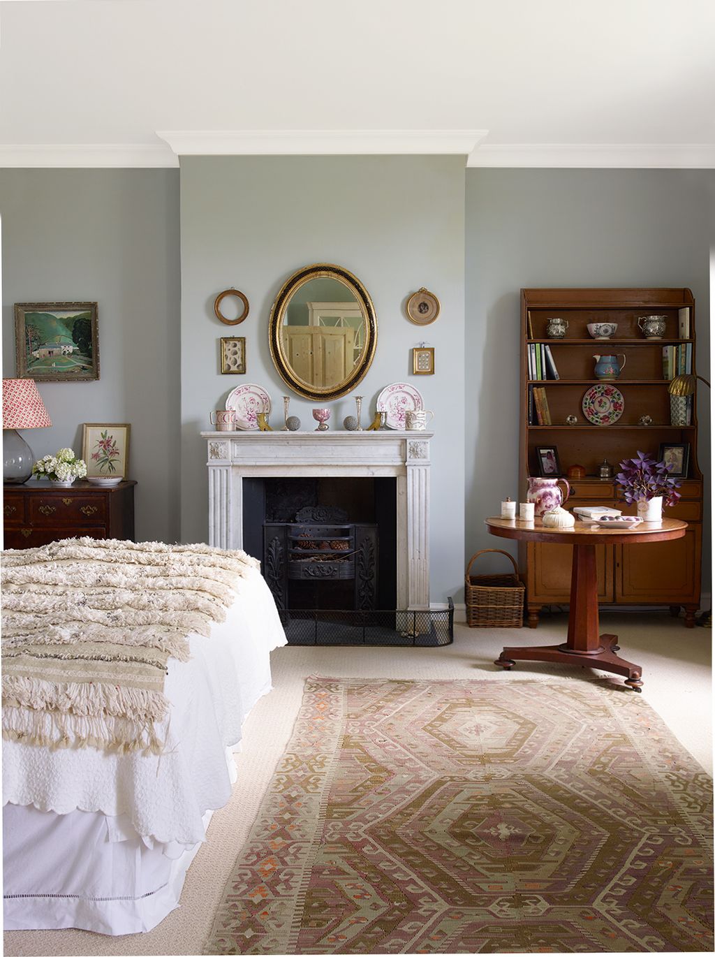 Image may contain Furniture Indoors Interior Design Living Room Room Flooring Rug Home Decor Fireplace and Bedroom