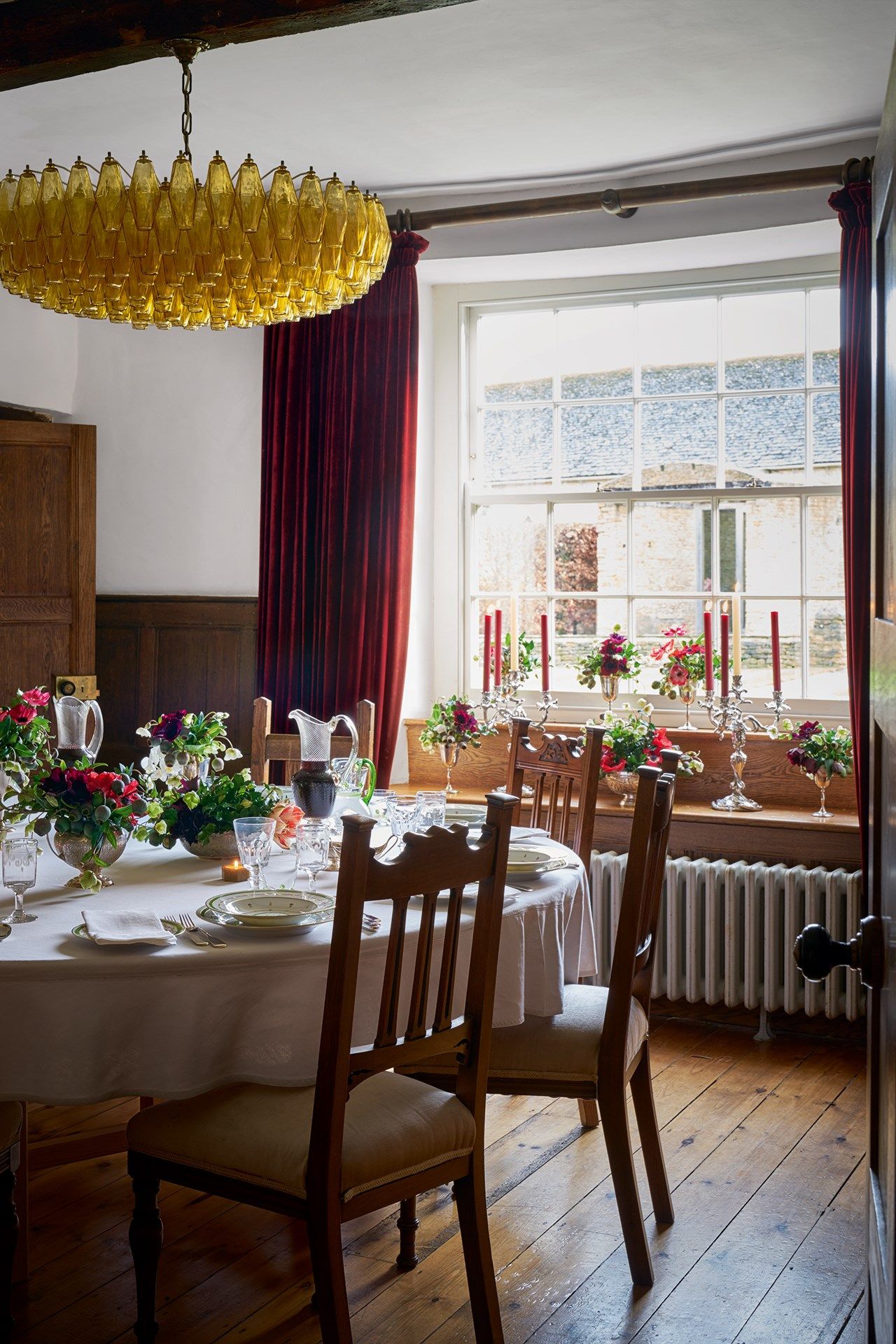 Image may contain Furniture Chair Interior Design Indoors Room Flooring Wood Plant Lamp and Chandelier