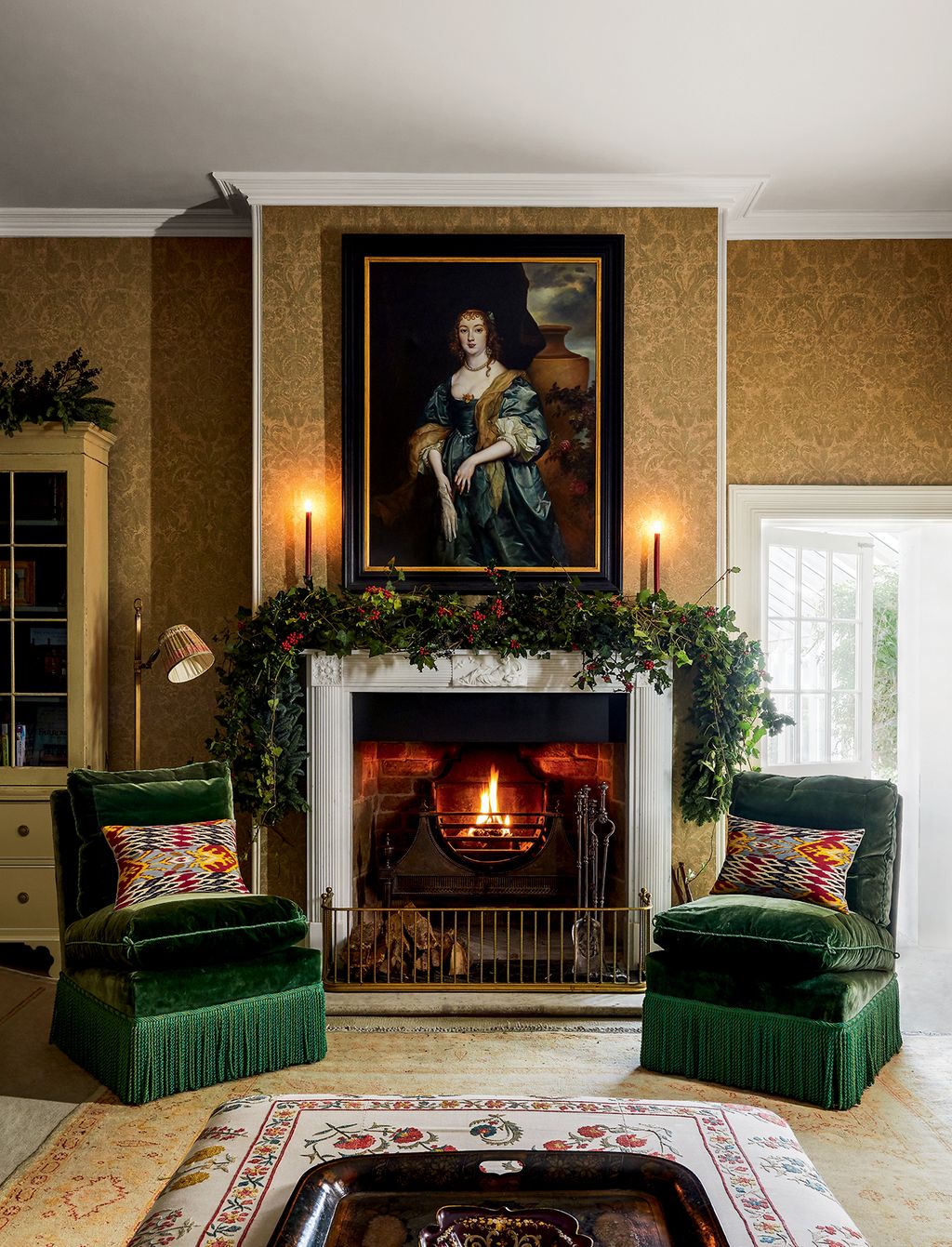 Image may contain Indoors Fireplace Hearth Living Room Room Human Person Furniture Interior Design and Cushion