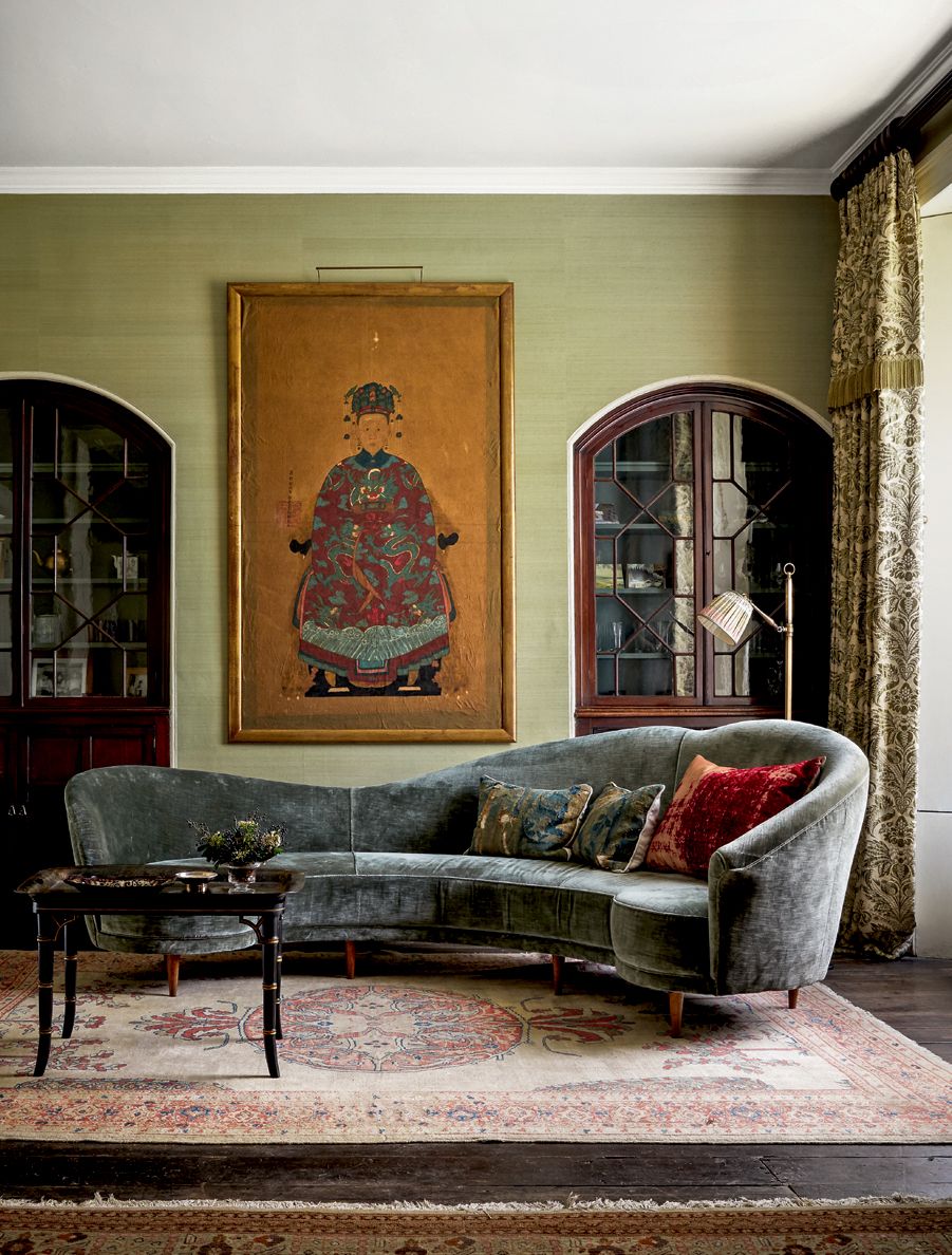 Image may contain Furniture Couch Living Room Room Indoors Flooring Human Person Rug and Floor