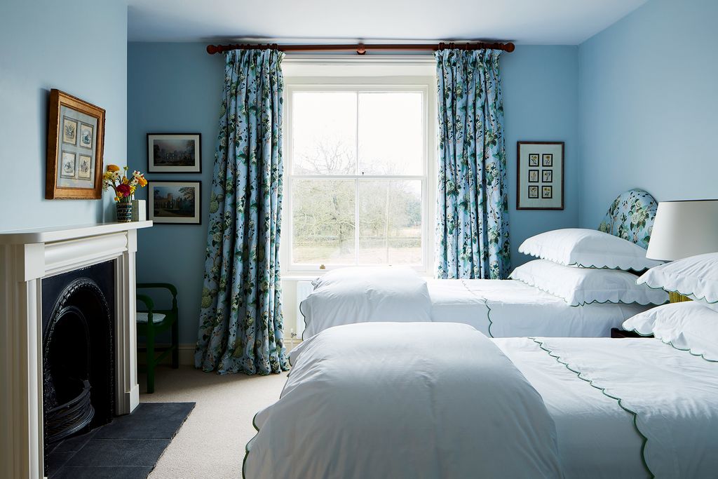 Image may contain Indoors Room Bedroom Furniture Bed Dorm Room and Interior Design