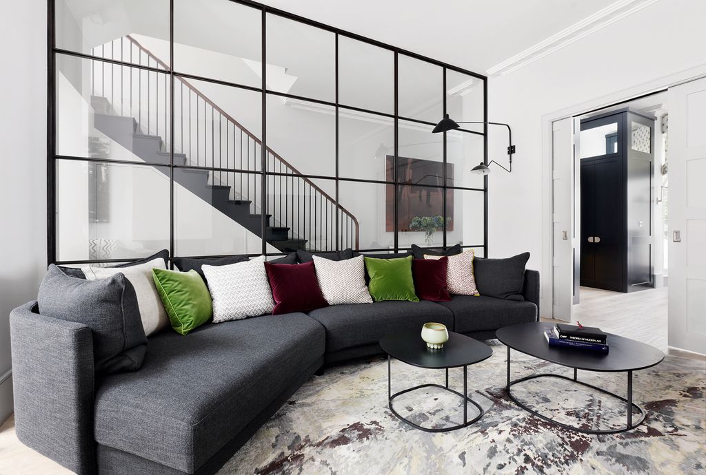 Image may contain Furniture Living Room Room Indoors Table Coffee Table Couch Cushion Rug and Interior Design