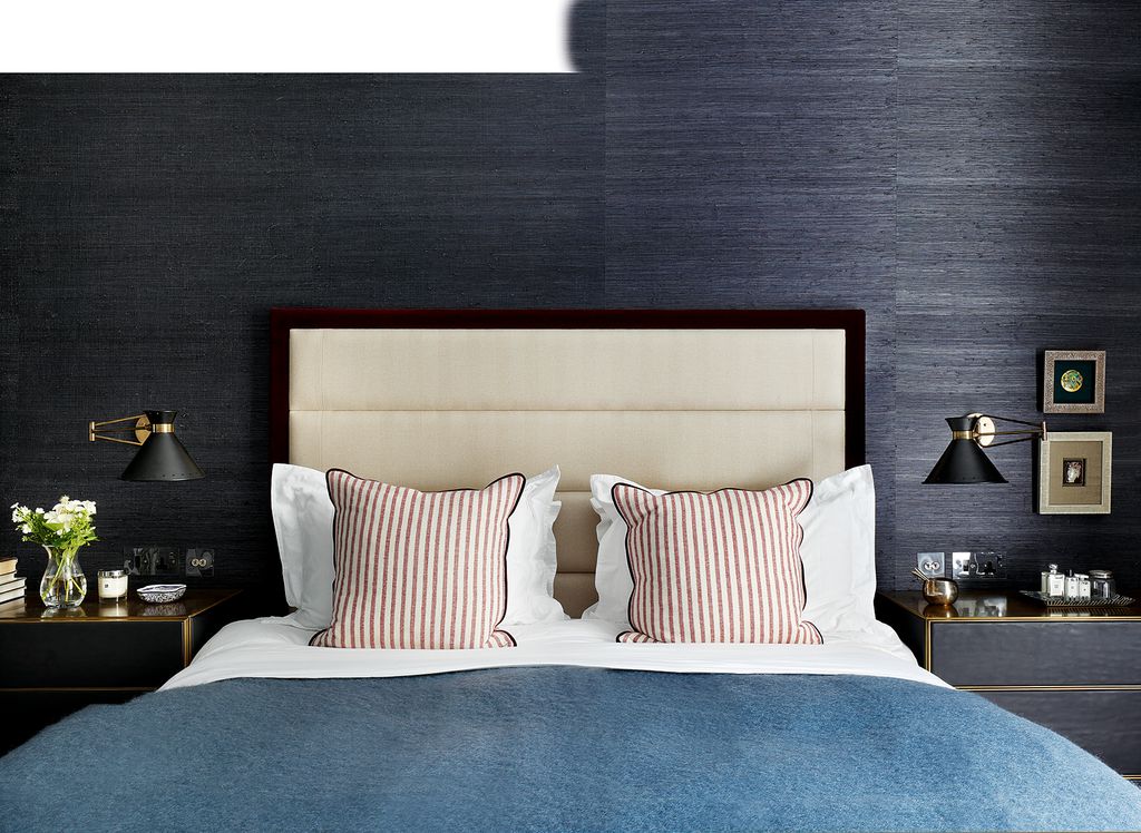 Image may contain Lamp Table Lamp Furniture Bed Indoors Room Bedroom Interior Design and Cushion