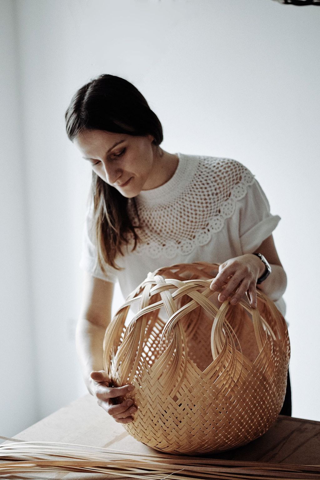 Image may contain Furniture Handbag Accessories Accessory Bag Human Person and Cradle