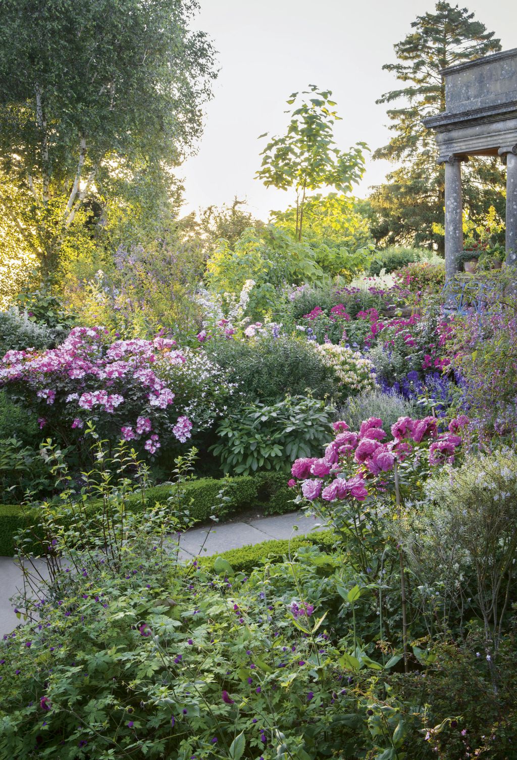 Image may contain Outdoors Garden Arbour Porch Patio Plant Pergola Flower and Blossom