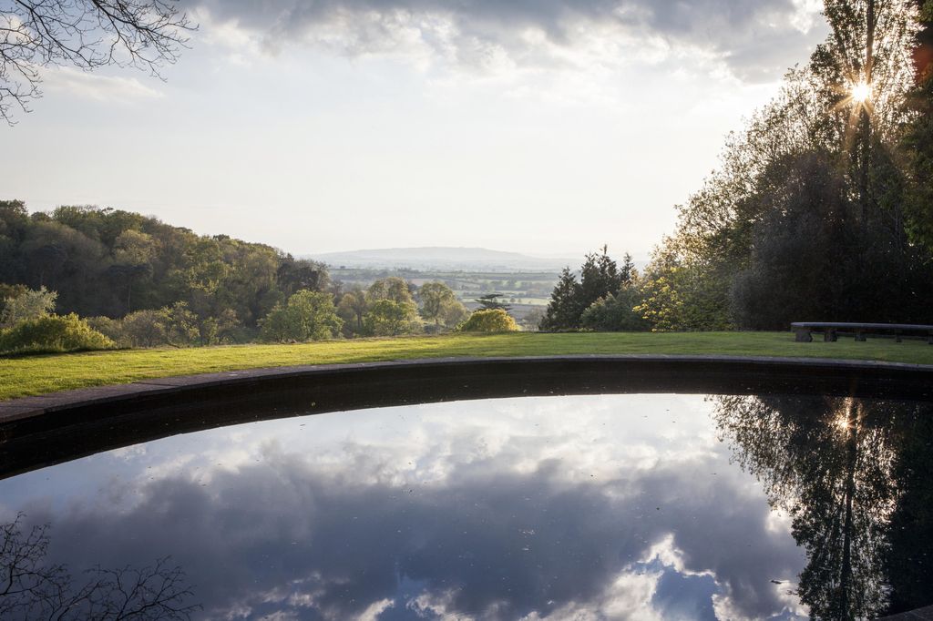 Image may contain Outdoors Field Golf Course and Water