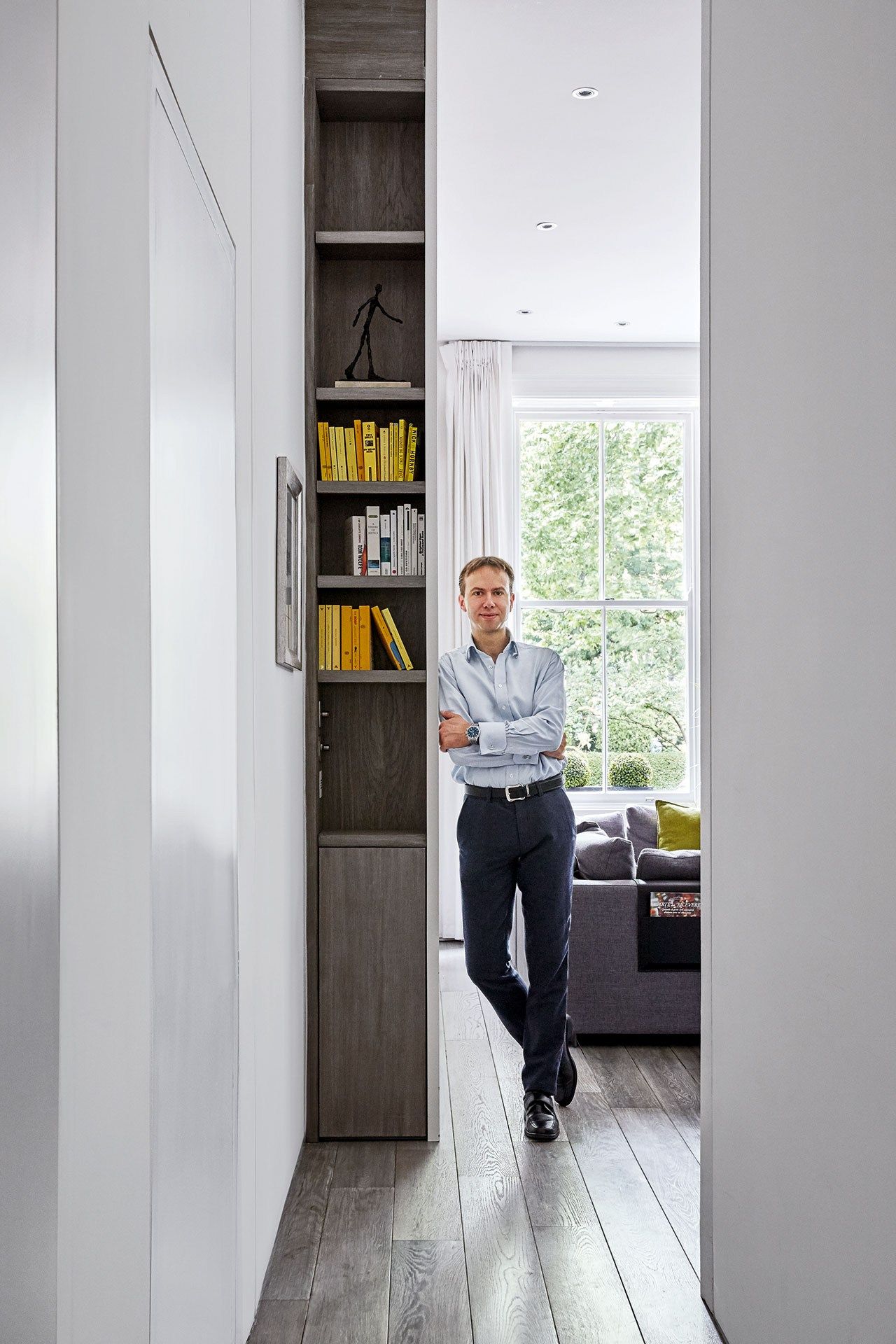 Image may contain Footwear Clothing Shoe Apparel Human Person Furniture Door Pants Shelf and Interior Design