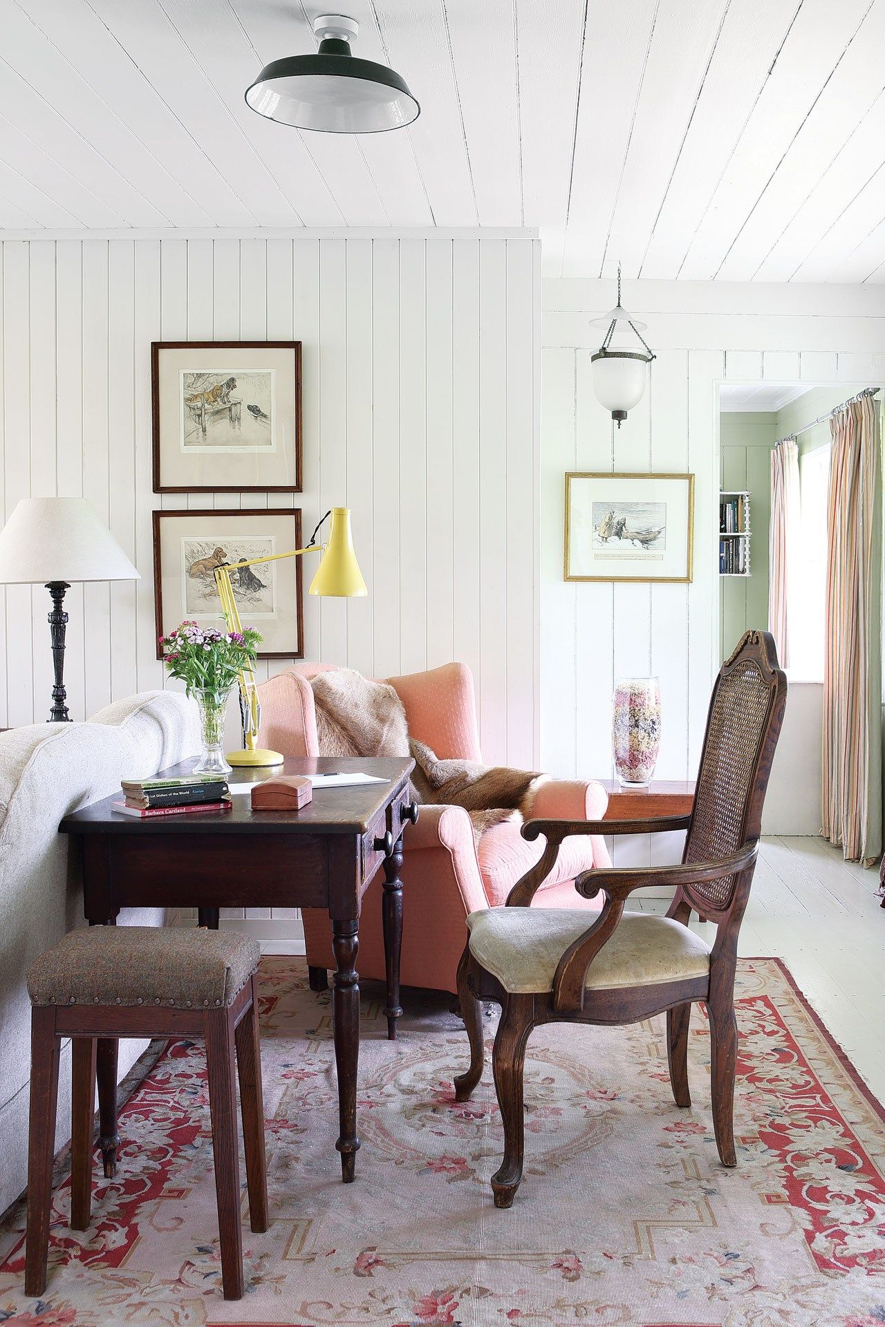 Image may contain Furniture Chair Living Room Room Indoors Table Home Decor Interior Design Cushion Pillow and Rug