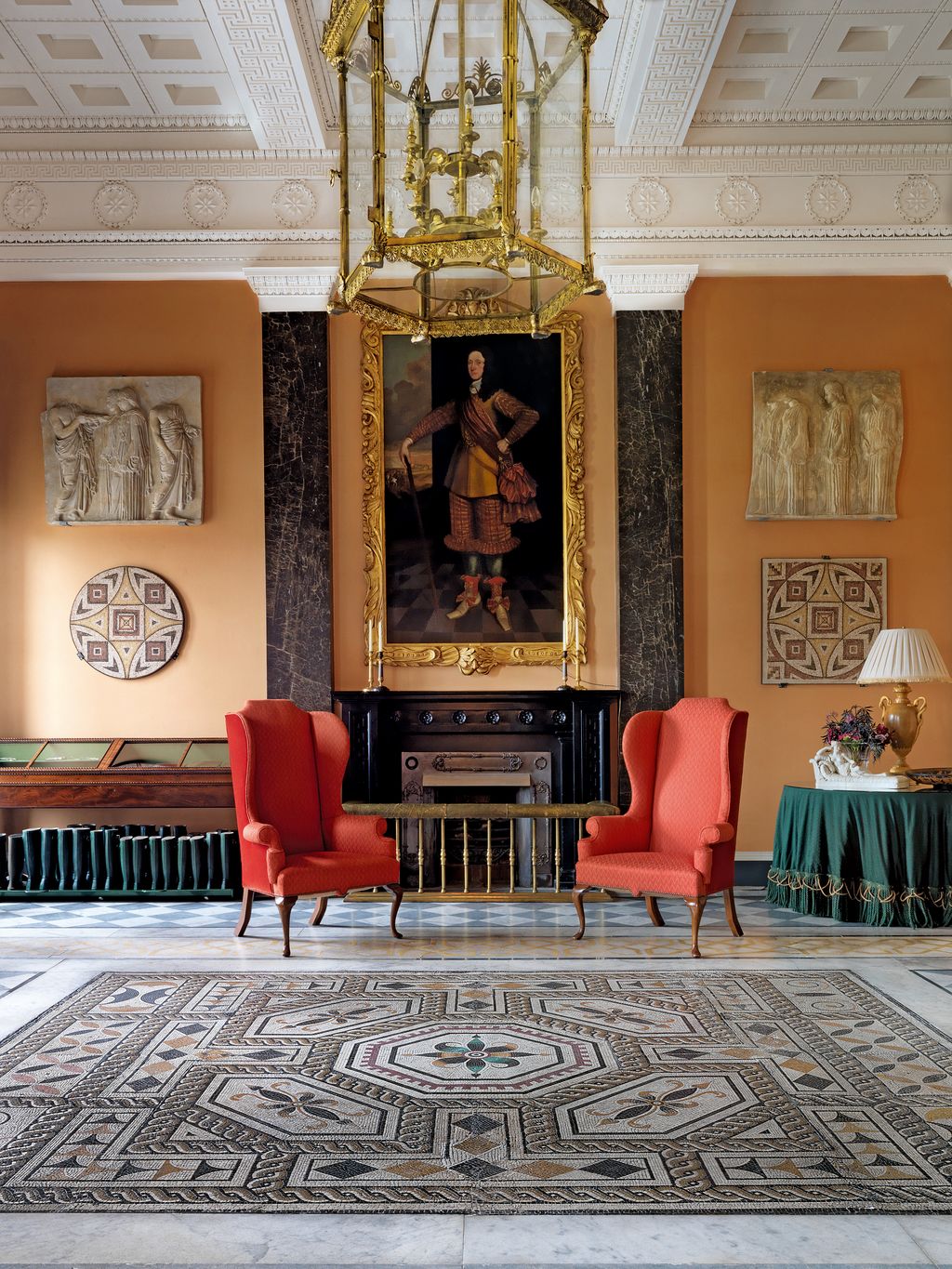 Image may contain Furniture Room Indoors Living Room Rug Chair Couch Flooring Human Person Lobby and Waiting Room