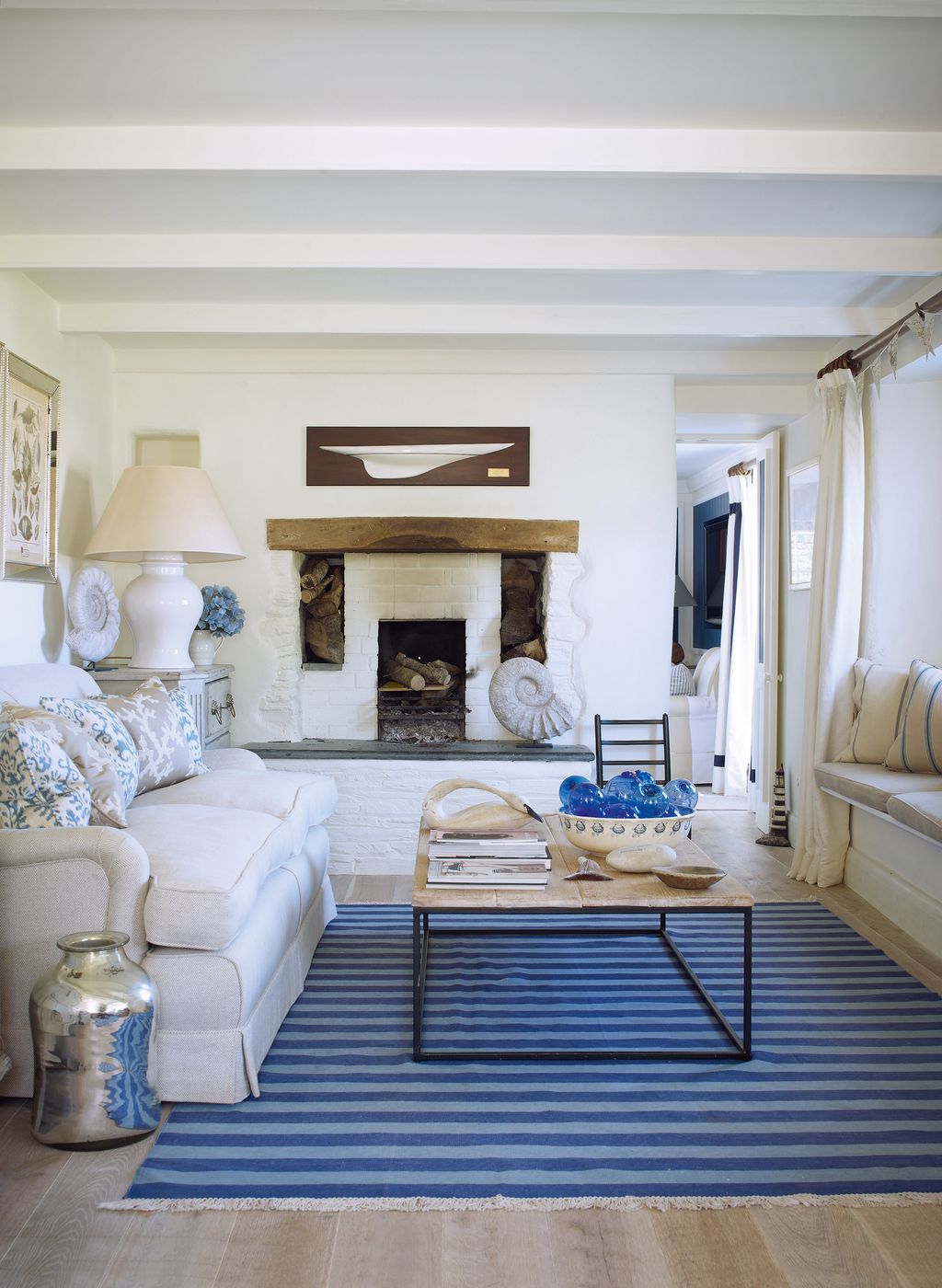 Fossils bought locally are dotted around the drawing room which has its original chimneypiece.