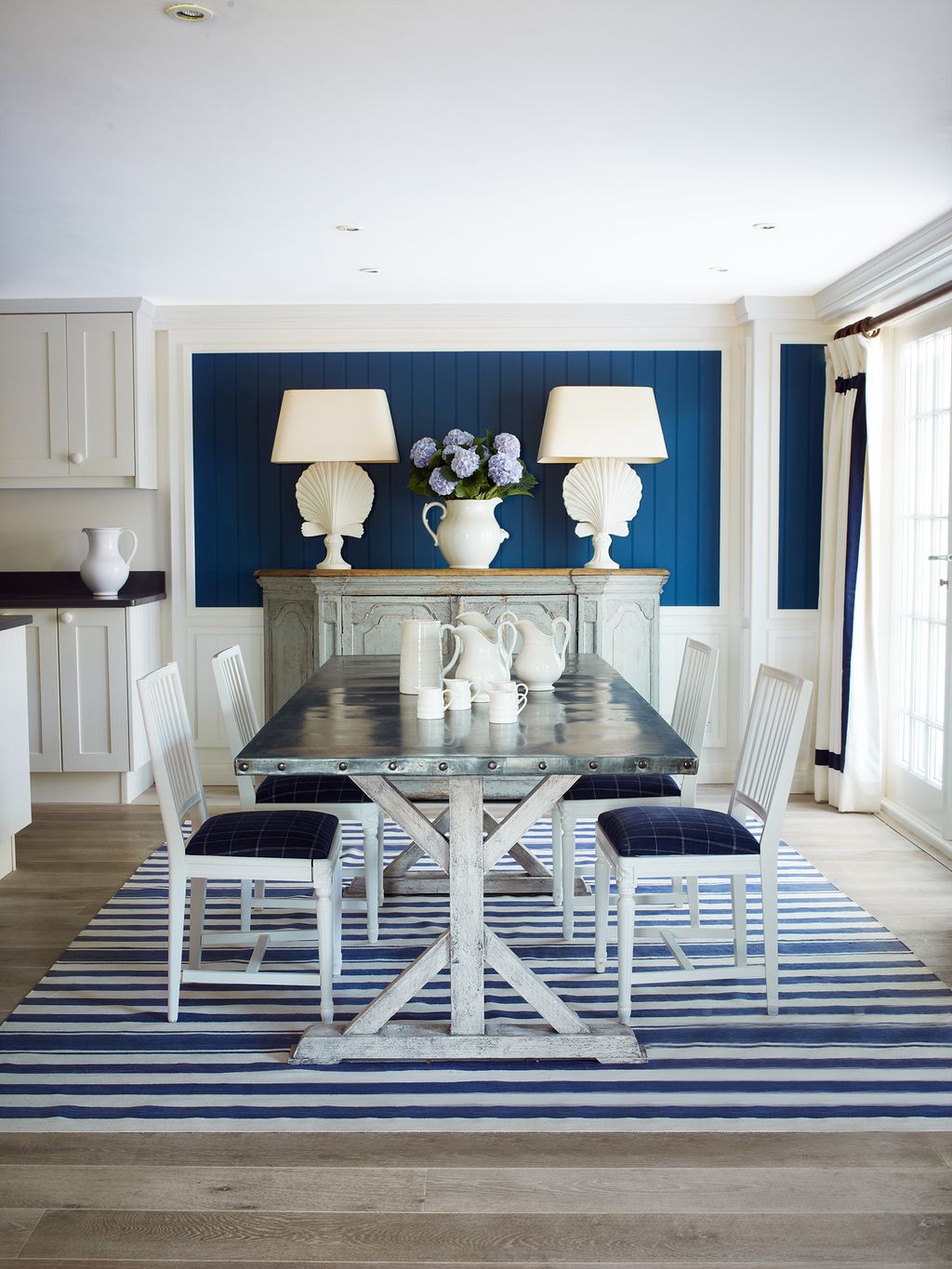 A collection of old pitchers is displayed in the dining area.