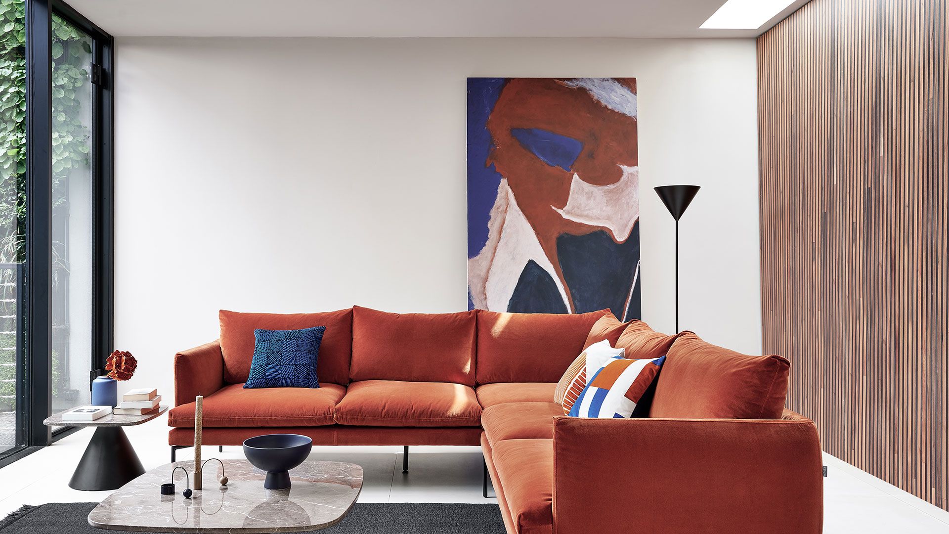 Image may contain Couch Furniture Living Room Indoors Room Table and Coffee Table