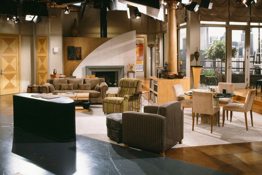 Image may contain Furniture Chair Flooring Couch Wood Living Room Room Indoors and Table