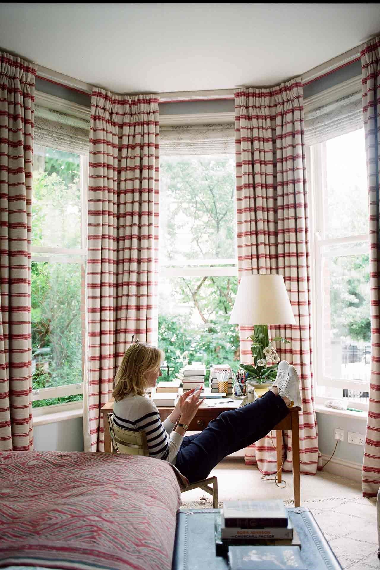 Image may contain Home Decor Human Person Living Room Room Indoors Furniture Bed Bedroom Window and Curtain