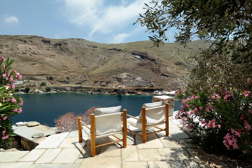 Built into the cliffside two listed residences form Faros Guest House with a stonepaved path leading down to a bathing...