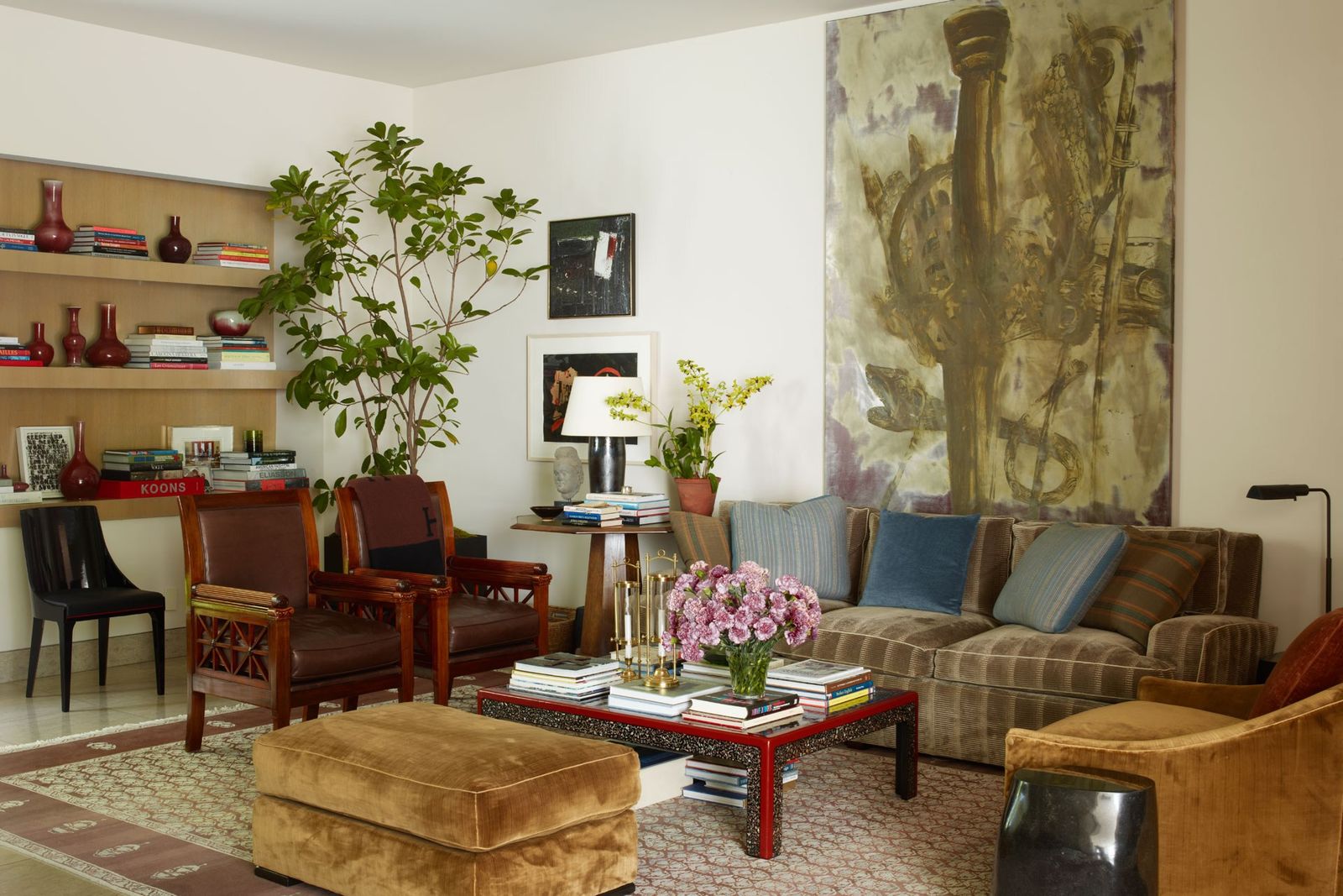 Image may contain Furniture Living Room Room Indoors Chair Table Couch Interior Design Lobby Coffee Table and Rug