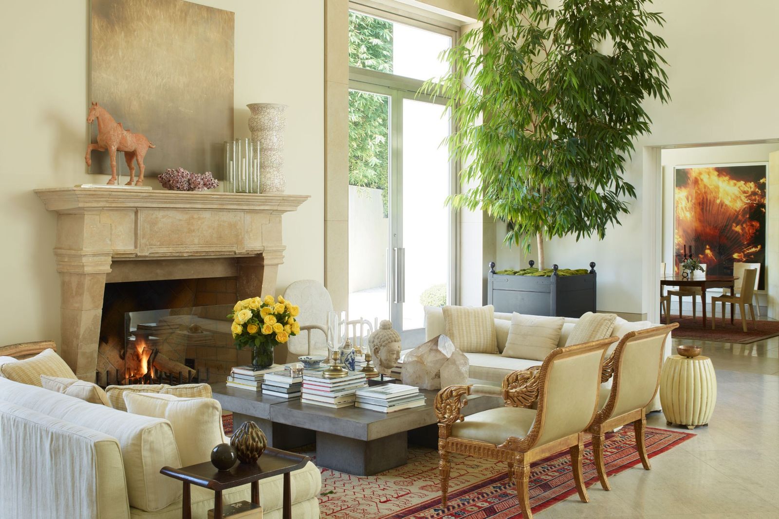 Image may contain Furniture Table Living Room Room Indoors Coffee Table Fireplace Tabletop Chair Couch and Rug