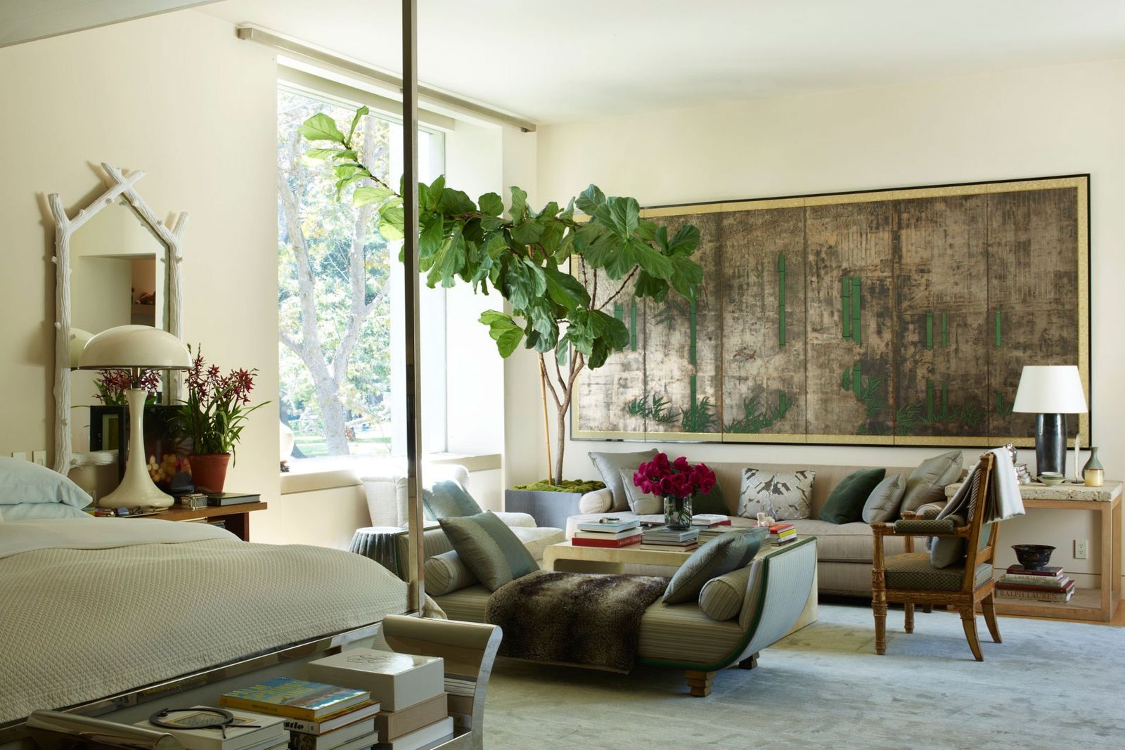 Image may contain Furniture Living Room Room Indoors Table Interior Design Plant Couch Rug and Coffee Table