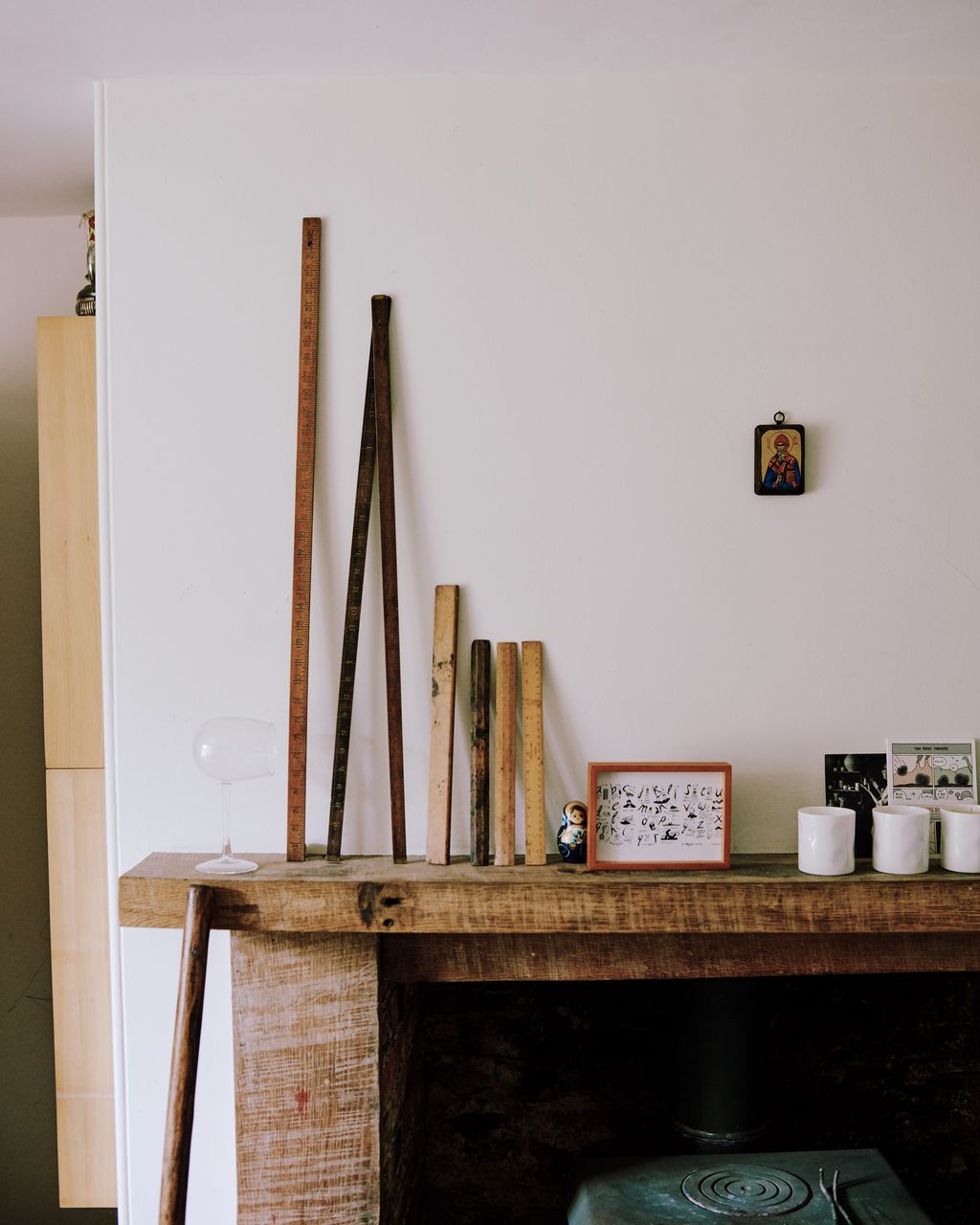 Image may contain Fireplace Indoors Shelf Hearth and Furniture