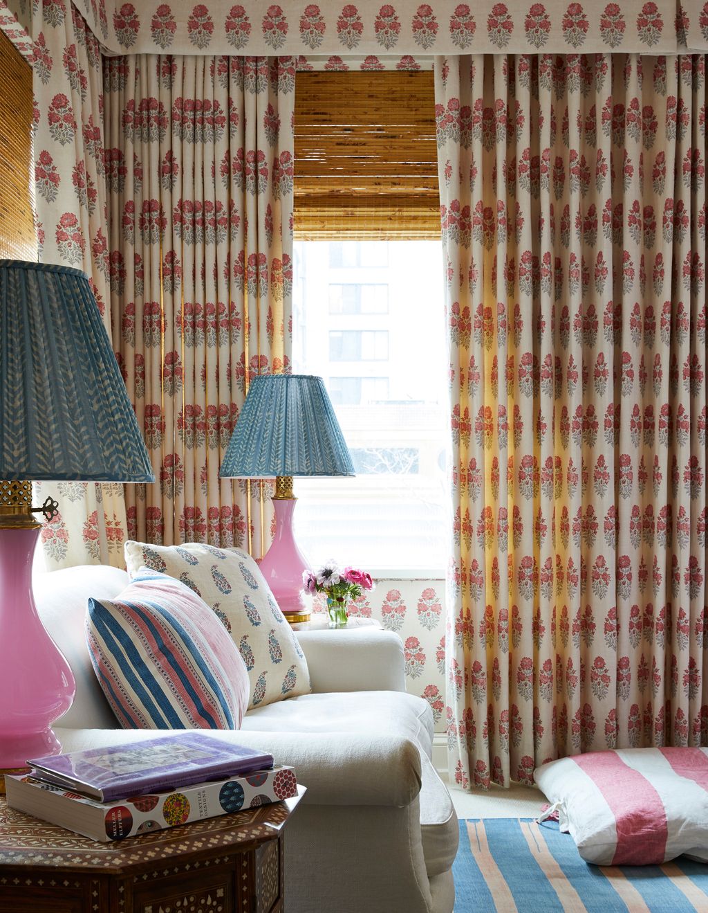 Image may contain Lamp Table Lamp Living Room Indoors Room Home Decor Furniture and Curtain