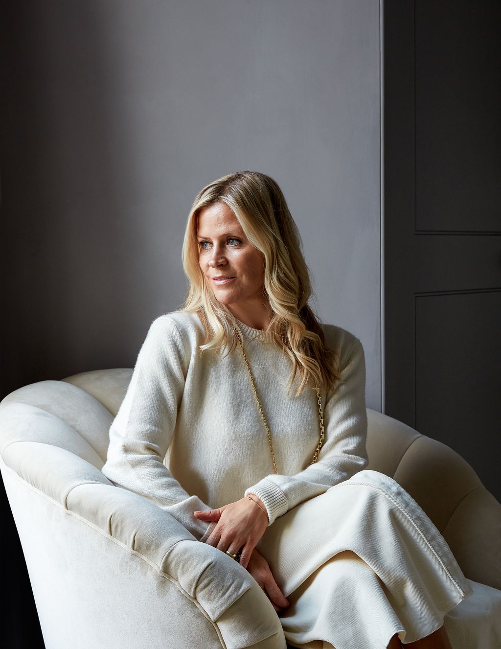 Image may contain Clothing Apparel Furniture Couch Human Person and Sleeve