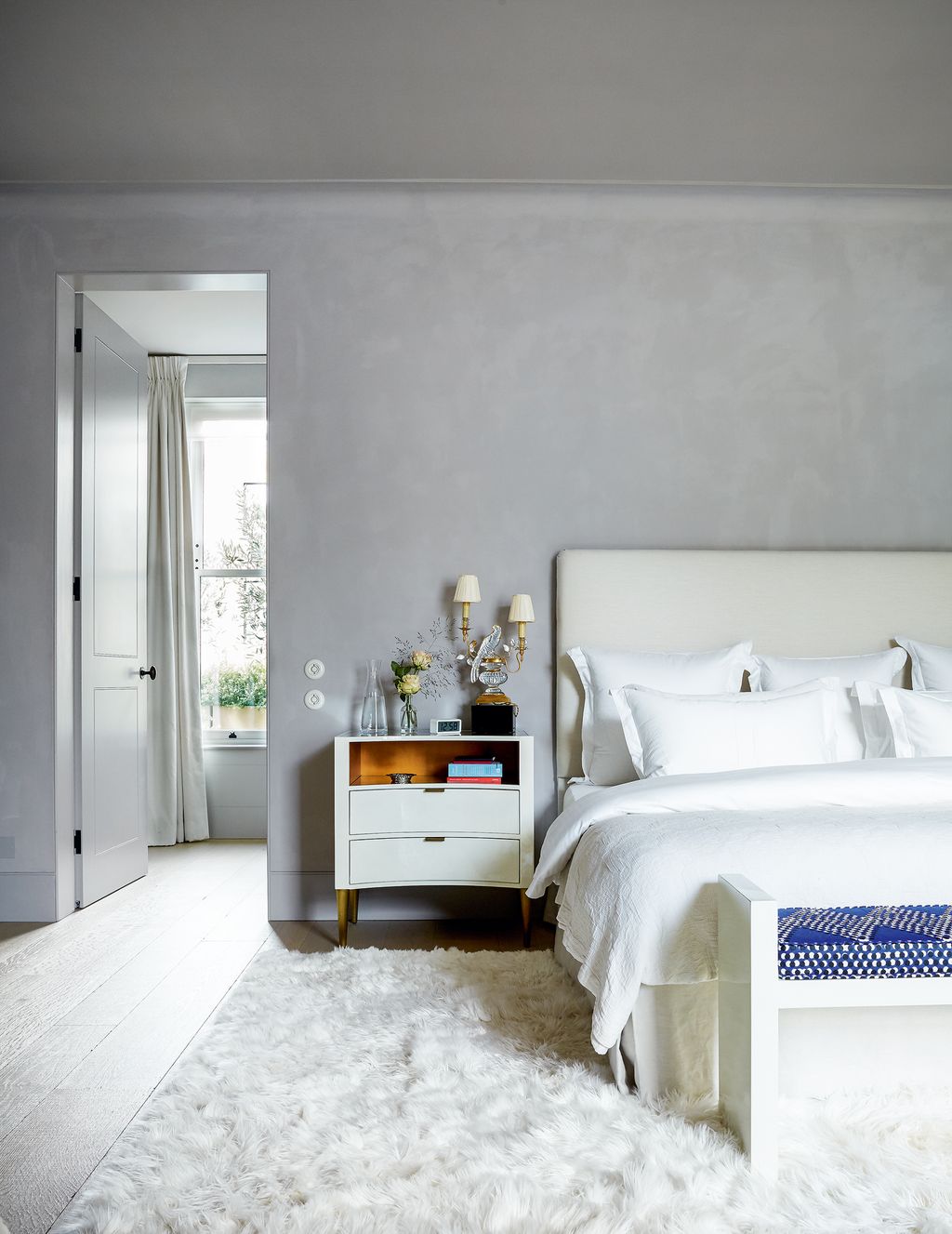 Image may contain Room Bedroom Indoors Furniture Rug Interior Design Flooring Bed and Dorm Room