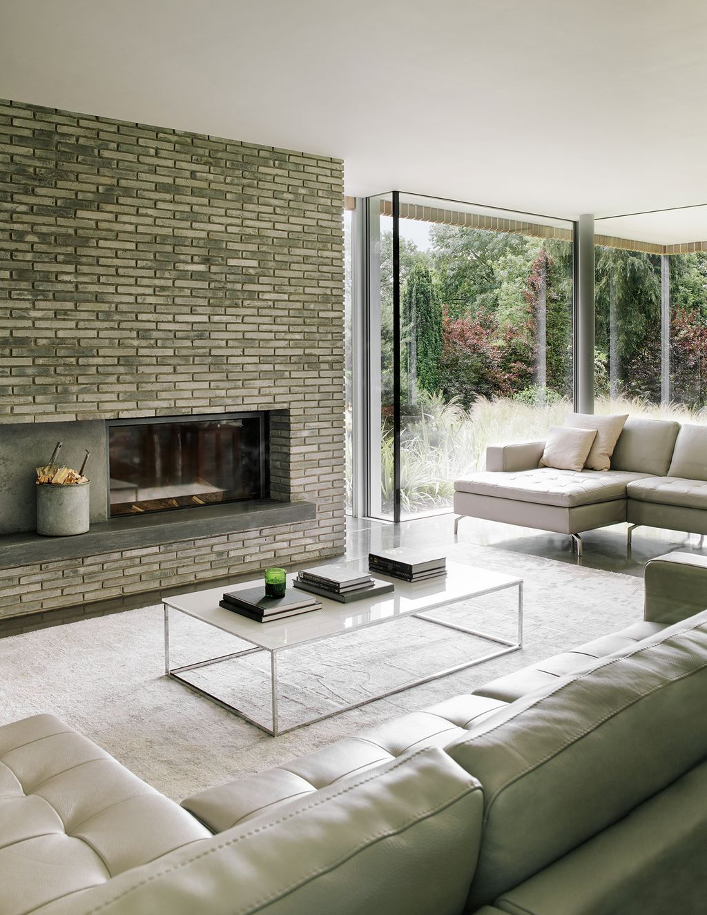 Image may contain Furniture Indoors Table Fireplace Rug Living Room Room Coffee Table Interior Design and Hearth