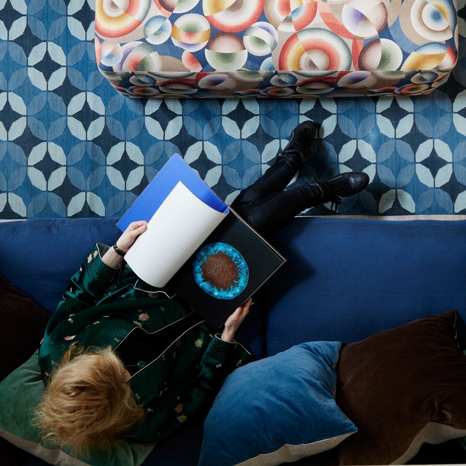 Image may contain Cushion Furniture Couch Pillow Clothing Apparel Human and Person