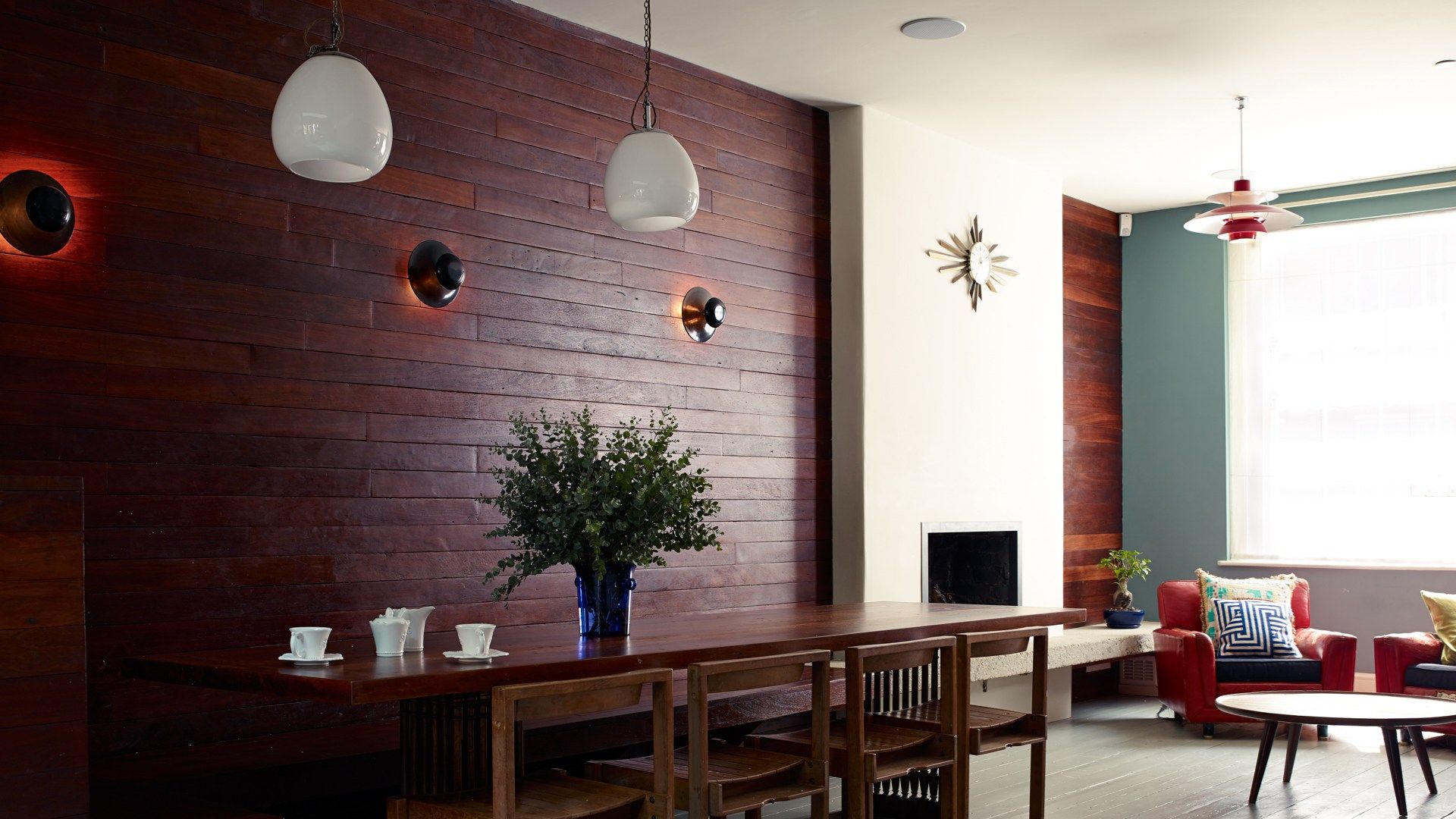 Image may contain Flooring Furniture Indoors Room Living Room Wood Chair Lobby and Interior Design