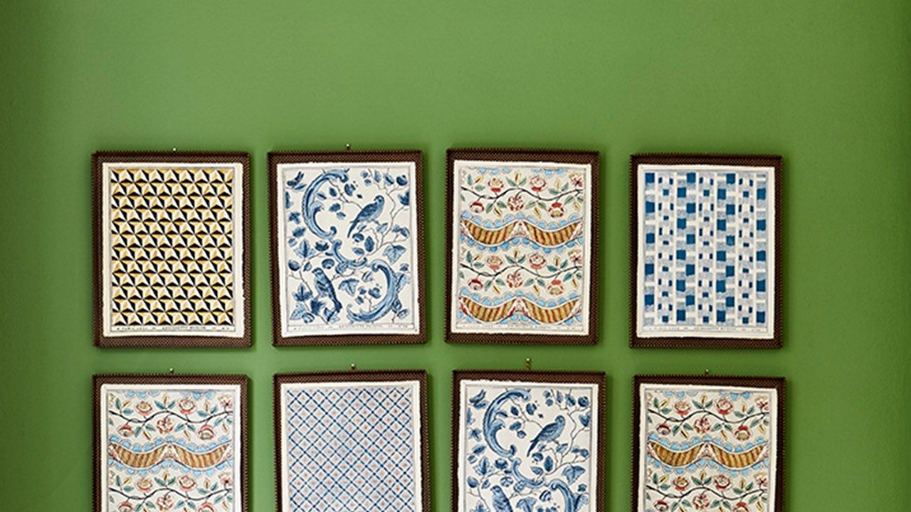 Image may contain: Lamp, Table Lamp, Room, Indoors, Interior Design, Rug, Living Room, Cushion, and Pillow