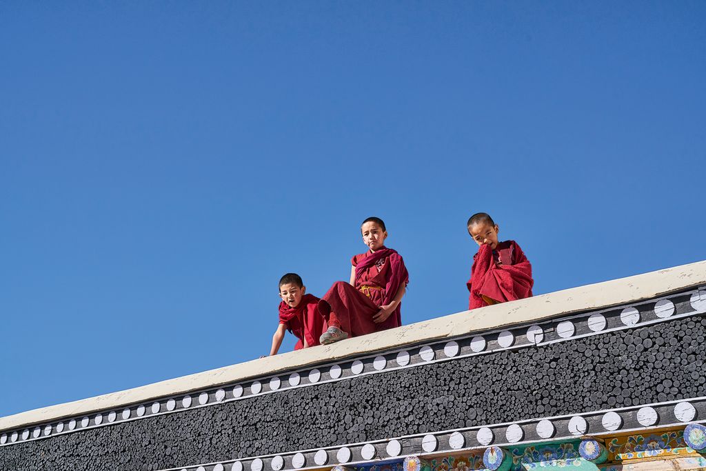 Image may contain Monk Human Person Building Housing Monastery and Architecture