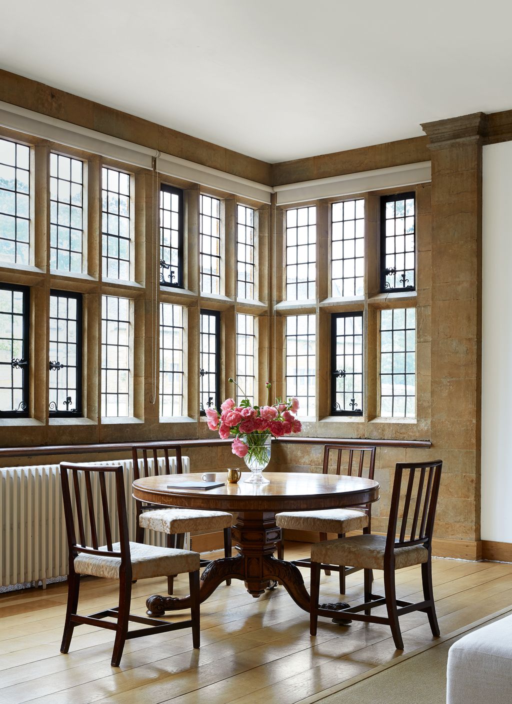 Image may contain Furniture Chair Wood Table Room Indoors Picture Window and Dining Table