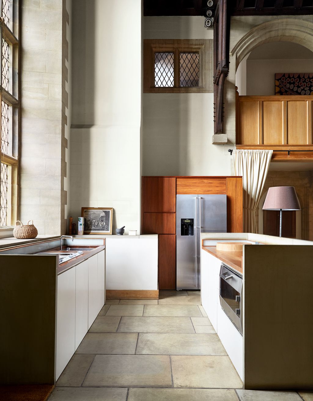 Image may contain Interior Design Indoors Flooring Room Housing Building Wood Floor and Kitchen