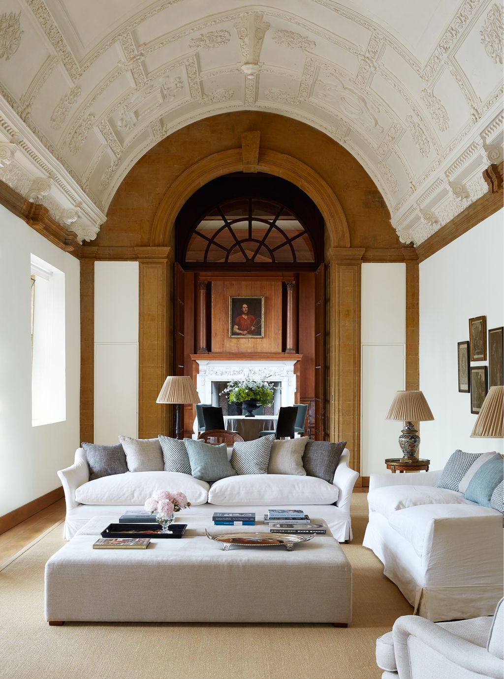 Image may contain Furniture Living Room Room Indoors Couch Interior Design Cushion Rug Table and Flooring