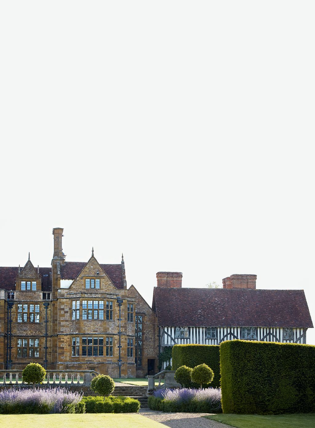 In front of the house garden designer Daniel Combes has revived Lutyens planting with box bay gaura and salvia.