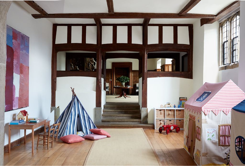 Now used as a playroom this former kitchen has an antique mahogany table from Alston  Ashton.