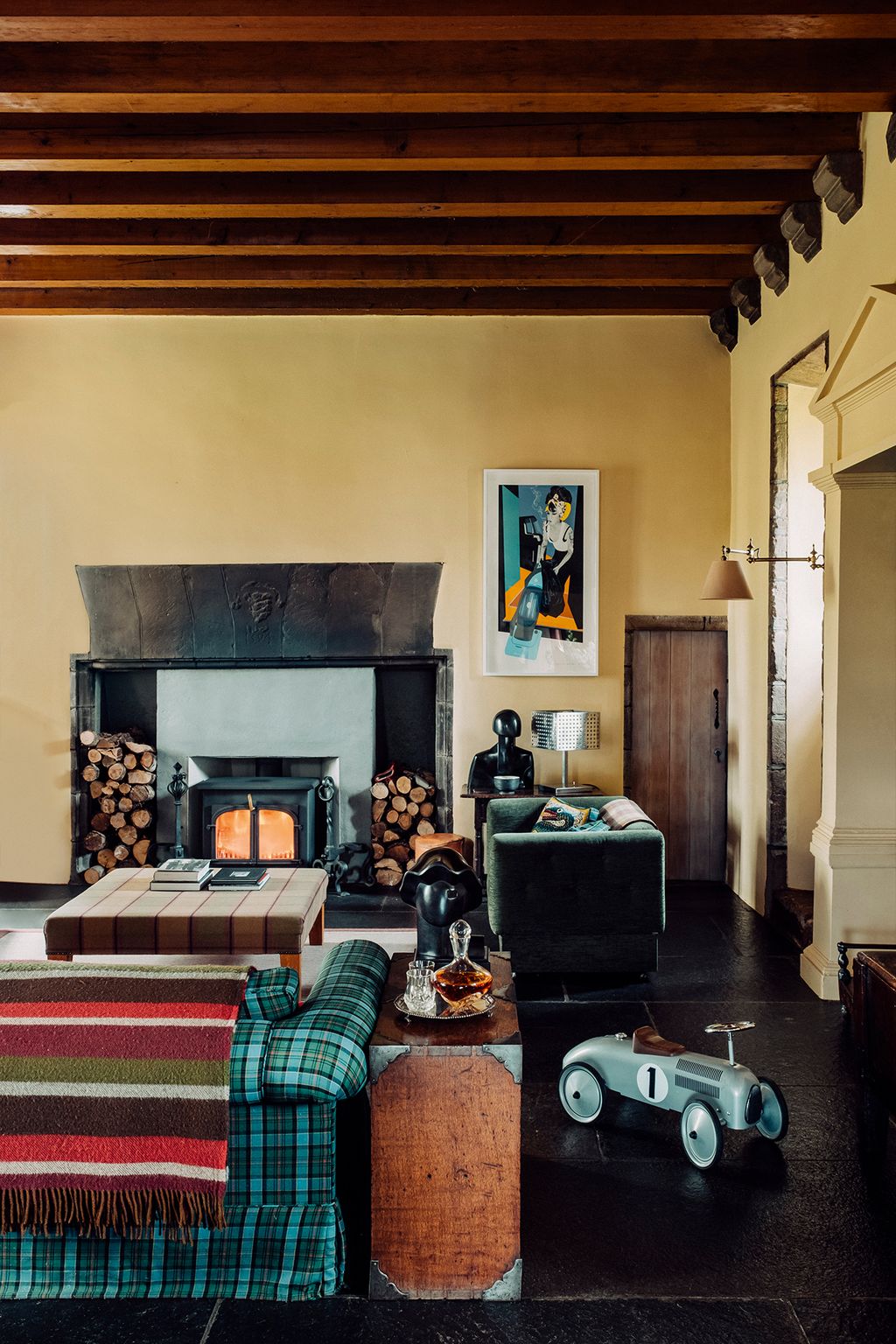 Image may contain Living Room Room Indoors Furniture Couch Hearth Interior Design Home Decor and Fireplace