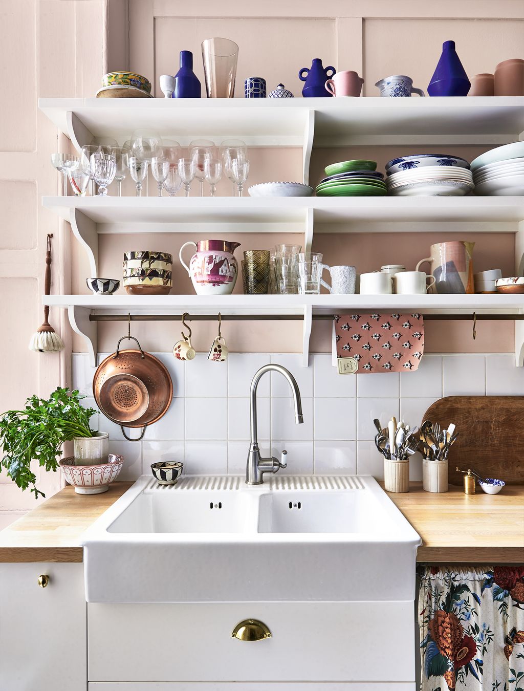 Image may contain Indoors Room Sink Faucet Shelf Kitchen and Interior Design