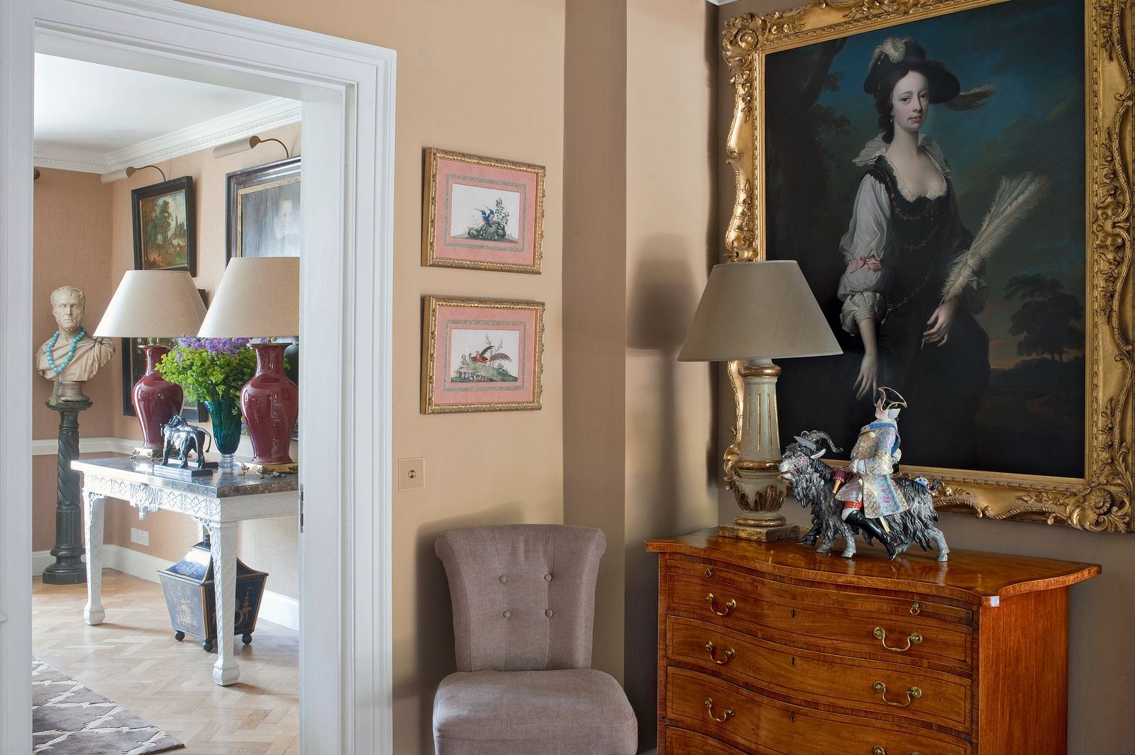 Image may contain Furniture Human Person Living Room Room Indoors Lamp Interior Design Flooring and Table Lamp