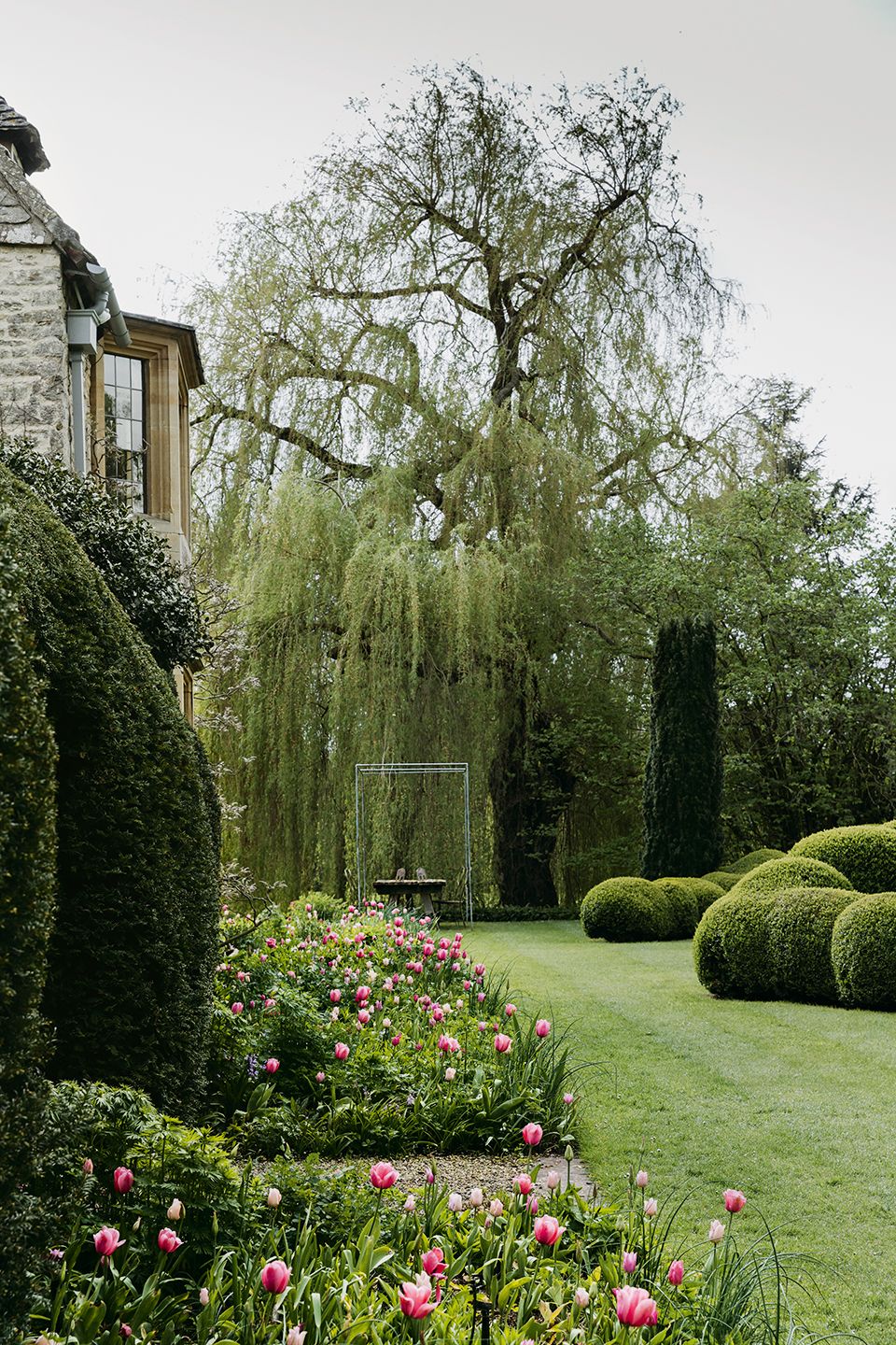 Image may contain Plant Grass Hedge Fence Outdoors Garden and Arbour