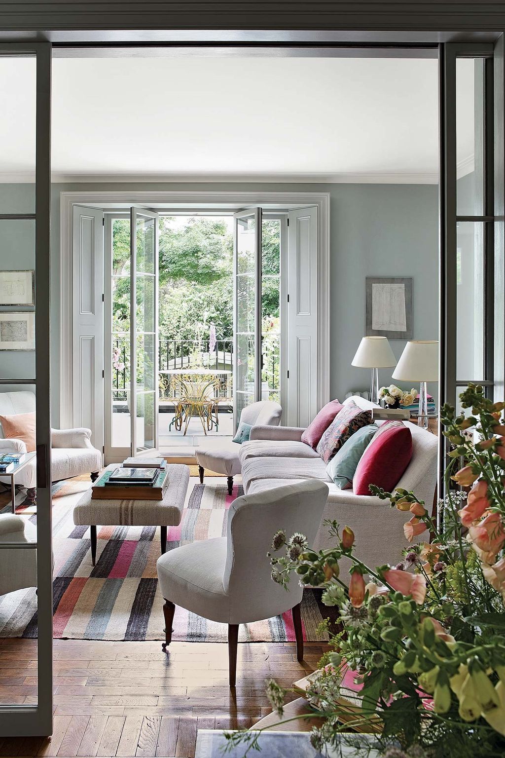 Image may contain Furniture Living Room Room Indoors Couch Chair Cushion and Rug